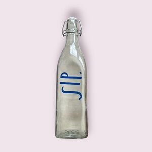 Rae Dunn Clear Glass Bottle with Blue 'SIP'